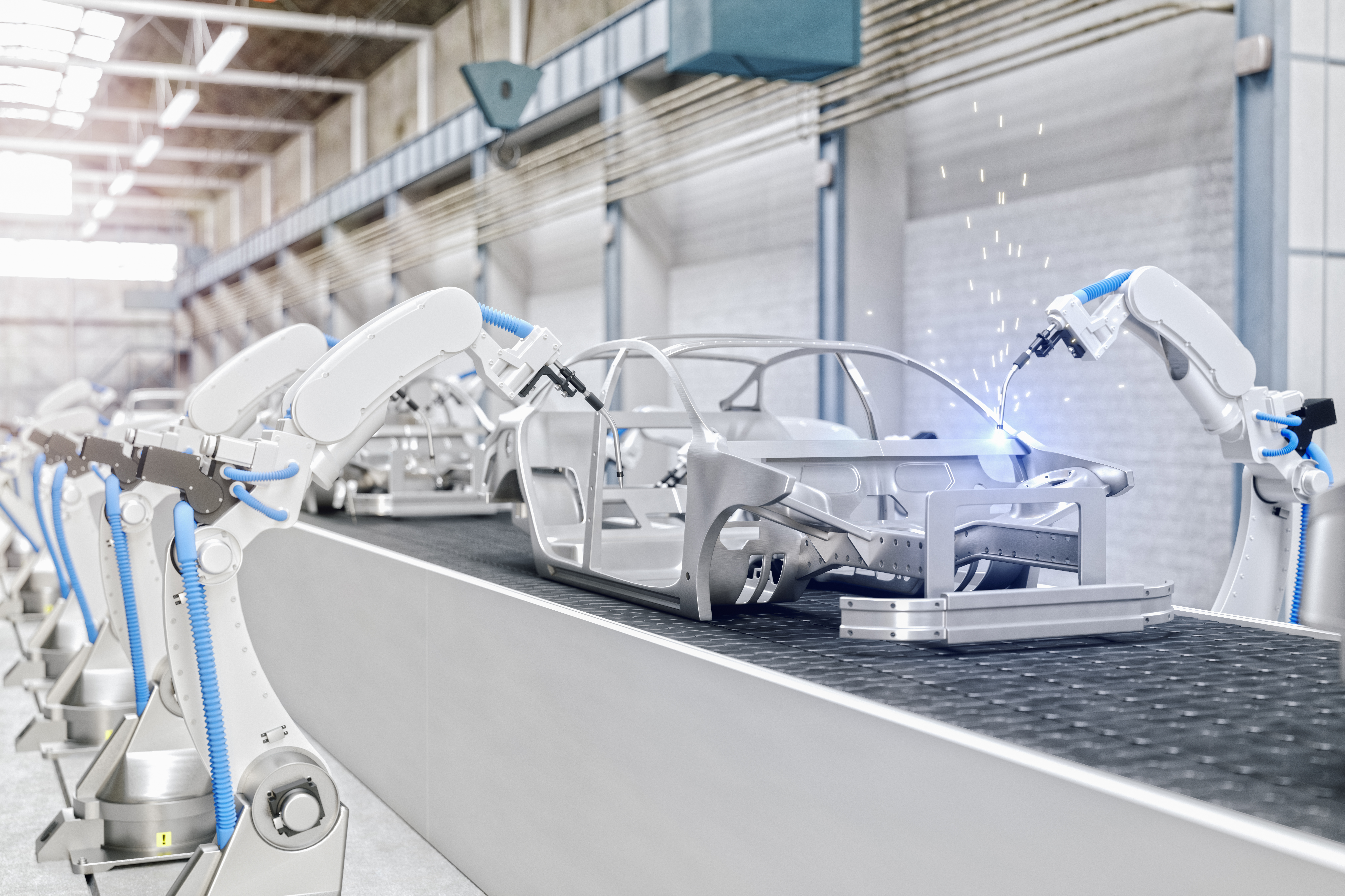 Industrial Robots At The Automatic Car Manufacturing Factory Assembly Line