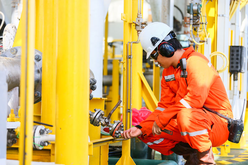 operator recording operation of oil and gas process at oil